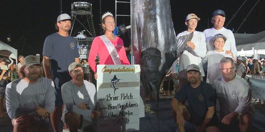 Junior angler Brantley Adams and the Destin-based Briar Patch crew with their 582.5-pound blue marlin at the Bay Point Billfish Open weigh-in Saturday June 27 - photo by Hayden Smith / WJHG
