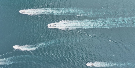 Aerial drone view of the 2026 Bay Point Billfish Open sportfish fleet running out at speed across the Gulf on Friday June 26 - photo by Dawson Miller / WJHG