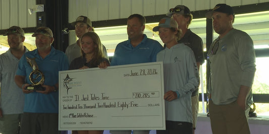 Orange Beach team It Just Takes Time on the Bay Point Billfish Open awards-day stage with the 210285 dollar first place Catch and Release check dated June 28 2026 - photo by WJHG