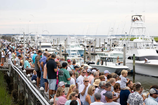 Crowd lines the docks at The Marina at Edisto Beach as the Edisto Invitational Billfish Tournament fleet returns on Day 1.