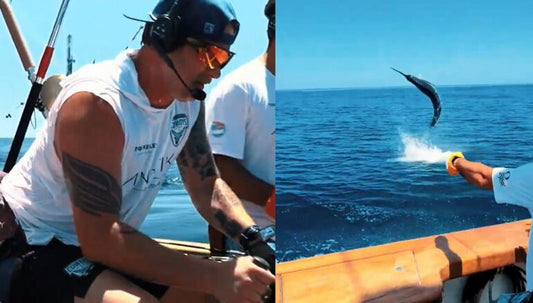 Gulf Coast Cowboys angler Brian Kelley at the helm with a marlin jumping behind the boat during the 2026 Gulfport Mississippi Open SFC tournament — image via Whiskey Riff editorial coverage