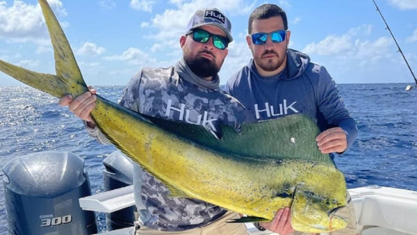 Huk performance fishing apparel on the water — angler lifestyle shot. Credit: Ocean Blue Fishing / Huk